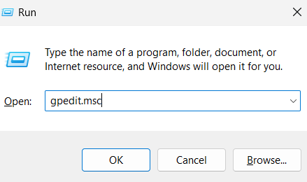 Type gpedit.msc and click OK.