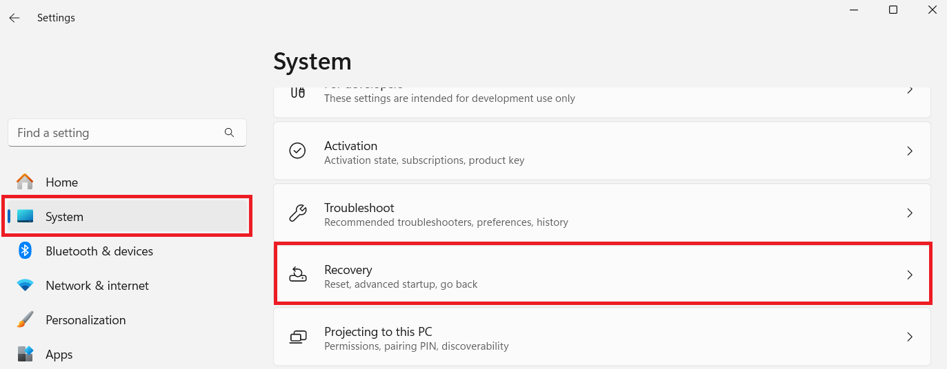 Go to Settings, click on System, scroll down, and select Recovery