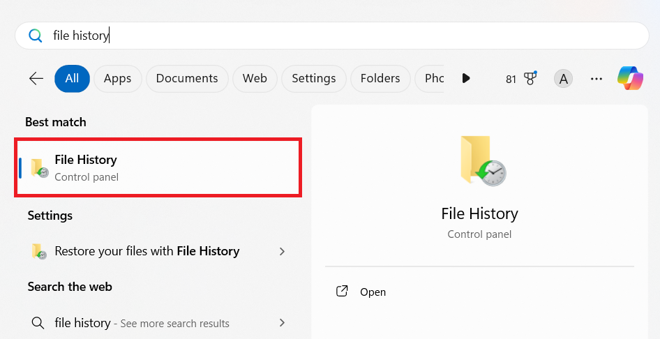 Search for File History in the Windows search bar and open the app